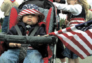 Caden Johnson of Snoqualmie was patriotic at last year’s Memorial Day ceremony at Kent’s Tahoma National Cemetery.