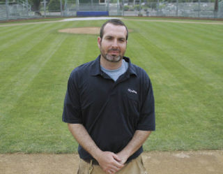 Parks-maintenance worker Darren Patrick oversees the condition of three ball fields for the City of Kent. He’s shown at Kent Memorial Park