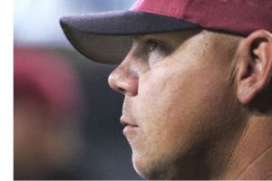 Kentlake baseball coach Jason Evans is focused on the action as the Falcons rally to beat defending state champion Richland in the Class 4A semifinals last month.