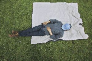 An unidentified man catnaps on the grass at Lake Meridian Park during the July 4 festivities. Never underestimate the value of a good nap.