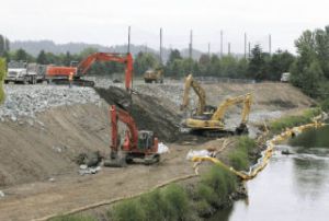 Work crews were out in force Tuesday doing repair work to the flood-control levee near the Riverbend Golf Course in Kent. A great deal more work needs to be done on levees throughout the Green River Valley