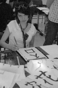 Kentlake High School student Trinity Smith practices her calligraphy during a cultural-exchange trip this month to Japan.