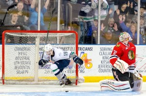 The Thunderbirds’ Donovan Neuls scores on Winterhawks goalie Cole Kehler during WHL action on March 19. Seattle came back from a three-goal deficit in front of a sellout crowd of 6