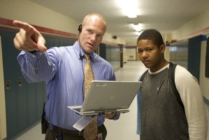 Kent-Meridian High School Principal Wade Barringer gives directions to a student while on his daily campus rounds. His 2013-2014 superintendent internship drew him away from school often