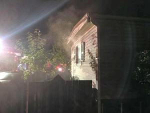 Firefighters converged to put out a fire that damaged a double-wide mobile home in Kent on Saturday night. No one was home at the time of the fire. COURTESY PHOTO