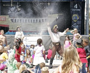 Cap'n Arrr burst a water balloon canon ball in the crowd Wednesday