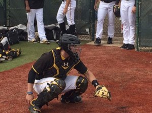 Kentwood High graduate Reese McGuire works behind the plate in Bradenton