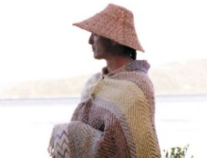 Michael Pavel wears a Salish robe woven by his wife