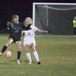 Kentwood High School junior Hailee Gabbard, left, works to keep the ball from West Valley High sophomore Jordan Karnes. Kentwood was eliminated from the first round of the 4A state soccer playoffs with a 1-0 loss to West Valley on Tuesday night in Yakima. COURTESY PHOTO, Tracy Arnold