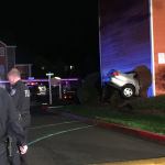 Kent Police and Kent RFA firefighters were on the scene after a vehicle struck an apartment building in the 10800 block of Southeast 240 Street on Saturday night. A man inside the apartment complex was killed, police reported. The two people in the car were not injured. COURTESY PHOTO, Kent RFA