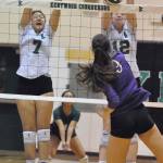 Kentwood&rsquo;s Alvina Ngo, left, and Erin Gould attempt to block a shot by Puyallup&rsquo;s Kaitlin Sugai during district action Saturday in the Conquerors gym. RACHEL CIAMPI, Reporter