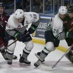 The Thunderbirds&rsquo; Mathew Barzel, left, and Ethan Bear battle the Giants behind the net during WHL play Saturday night in Vancouver, B.C. COURTESY PHOTO