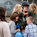 Navy pilot Daniel Cochran greets his children after returning from a mission. COURTESY PHOTO, U.S. Navy Petty Officer 3rd Class Matthew C. Duncker