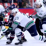 The Thunderbirds&rsquo; Luke Ormsby (23) and Alexander True (16) battle the Americans&rsquo; Carson Focht for the puck during WHL play in Kennewick on Friday night. COURTESY PHOTO, Judy Simpson