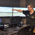 Jerry Wolfe, aviation faculty and bachelor&rsquo;s degree program director at Green River College, points out features of an air traffic control tower simulator at the college&rsquo;s new Auburn Center. HEIDI SANDERS, Kent Reporter