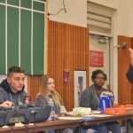 Kent Police Chief Ken Thomas talks to teenagers during the recent Game of Life Youth Conference at the Kent Commons. Behind Thomas are members of the Kent Police Youth Board, a group of diverse teens dedicated to community leadership who helped organize the Dec. 13-14 event with the support of the Kent Police Department. RACHEL CIAMPI, Reporter