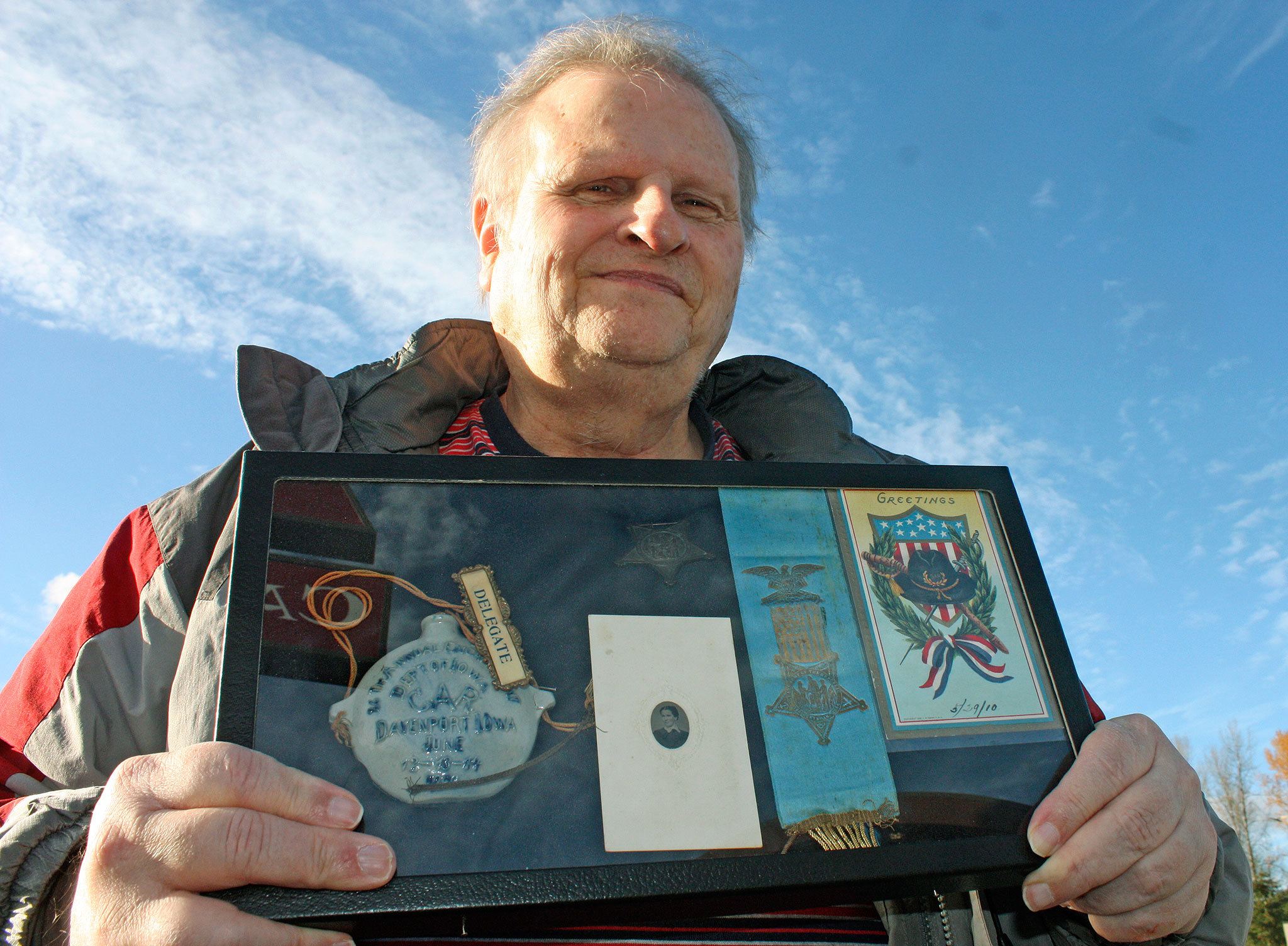 Kent&rsquo;s Jim Dimond, a historian, holds a collection of mementos from Civil War veterans. Dimond ensures lost or forgotten Civil War veterans are recognized. MARK KLAAS, Kent Reporter