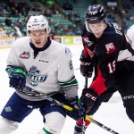 The Thunderbirds&rsquo; Scott Eansor and the Cougars&rsquo; Brogan O&rsquo;Brien battle for position during WHL action Friday night. COURTESY PHOTO, Brett Cullen