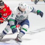 The Thunderbirds&rsquo; stickless Nolan Volcan and the Winterhawks&rsquo; Skyler McKenzie scramble for the loose puck during WHL action Friday night at the ShoWare Center. COURTESY PHOTO, Brian Liesse/T-Birds
