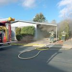 Firefighters take on a mobile home fire in the 20800 block of 116th Avenue SE on Tuesday, Dec. 20.