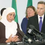 Risho Sapano, executive director of the Mother Africa resource center in Kent, speaks at a Dec. 15 press conference as King County Executive Dow Constantine looks on during an annoucement about funding for 27 nonprofit groups as part of the Best Starts for Kids levy.
