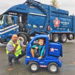 Republic Services&rsquo; residential recycling collection driver Robert McKee and a little boy named Max. COURTESY PHOTO