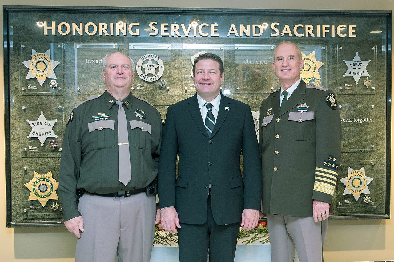 King County Sheriff&rsquo;s Office Capt. Greg Thomas, Council Vice Chair Reagan Dunn and Sheriff John Urquhart at the unveiling of the memorial for deputies killed in the line of duty.
