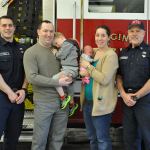From left, Puget Sound Fire firefighter Kevin Price, Nick Lowery, 3-year-old Noah Lowery, 1-month-old Mia Lowery, Kelley Lowery and Capt. Guy Thompson. On Saturday, the Lowery family visited Price and Thompson, who helped delivered Mia at Fire Station 77 on Dec. 21. HEIDI SANDERS, Kent Reporter