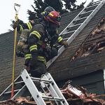 Firefighters from Puget Sound Fire attack and put out a fire at a two-story home in Kent on Saturday afternoon. COURTESY PHOTO