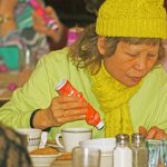 Christina Welch plays along during a bingo fundraiser at the Kent Senior Activity Center on Wednesday. Christina was accompanied by her husband, Will. MARK KLAAS, Kent Reporter