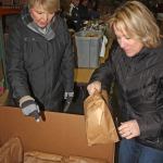 Volunteers Shelly Brown, right, and Loretta Shindler organize food-filled bags during the Backpack Buddy Program&rsquo;s packing party at Seattle&rsquo;s Union Gospel Mission warehouse in Kent on Jan. 4. MARK KLAAS, Kent Reporter