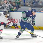 The Thunderbirds&rsquo; Scott Eansor, right, and the Winterhawks&rsquo; Caleb Jones pursue the puck during WHL play. COURTESY PHOTO, Brian Liesse/T-Birds