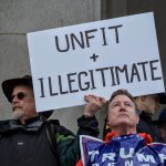 Olympia resident Dave Siemens, left, and Lacey resident Michael Bane stand in support of their opposing positions at the Youth Unity Rally on Friday. Siemens was there to protest Trump&rsquo;s inauguration while Bane was there to show his support the new president. COURTESY PHOTO, Grace Swanson/WNPA Olympia News Bureau
