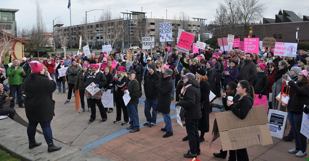 Pro-choice and Planned Parenthood supporters gather for a rally at Kent&rsquo;s Town Square Plaza before making their way up the hill to the Planned Parenthood clinic. HEIDI SANDERS, Kent Reporter