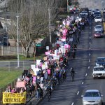Hundreds of Planned Parenthood supporters make their way up the James/240th Street Hill on Saturday in response to calls to defund the organization. HEIDI SANDERS, Kent Reporter