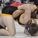 Kent-Meridian senior Gerardo Suarez, top, battles Tahoma&rsquo;s Nick Whitehead in the 132-pound match for third place in Mat Classic XXIX at the Tacoma Dome on Saturday. Whitehead won by fall. RACHEL CIAMPI, Reporter