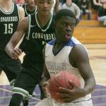 Kentwood&rsquo;s Rayvaughn Bolton guards a Federal Way player during a regional playoff game. Bolton was named WIAA 4A boys Athlete of the Week for his performance in the state championship game on March 4, which Kentwood won. REPORTER FILE PHOTO