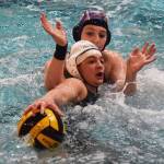 Kentridge&rsquo;s Sam Gilman (3) works with the ball as Auburn Mountainview&rsquo;s Janeese Singer defends during water polo action Thursday. RACHEL CIAMPI, Kent Reporter