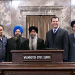 Sen. Joe Fain, with Sikh leaders, in the Senate chambers on Tuesday. COURTESY PHOTO