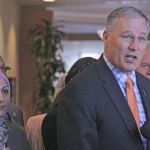 Gov. Jay Inslee joins interfaith and neighborhood leaders for an impromptu news conference at Kent&rsquo;s Centennial Center on Thursday. Inslee visited Kent for a roundtable discussion on hate crimes. MARK KLAAS, Kent Reporter