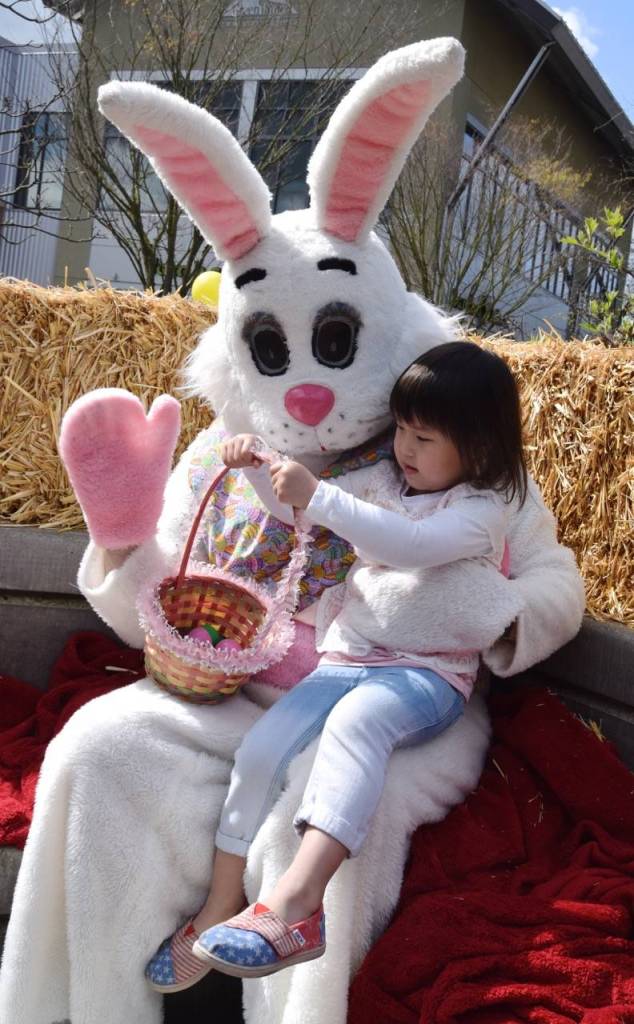 Breanna Diep, 3, shows the Easter Bunny her eggs. RACHEL CIAMPI, Kent Reporter