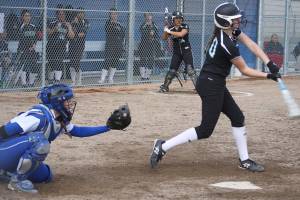 Kentwood freshman Kaci Imus swings for a pitch midway through Thursday&rsquo;s game at Hazen. SARAH BRENDEN, The Reporter