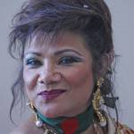 Nina Khan, of Nina&rsquo;s Fashionista Jewelry and Boutiques, smiles as she sells her sparkling selections. MARK KLAAS, Kent Reporter