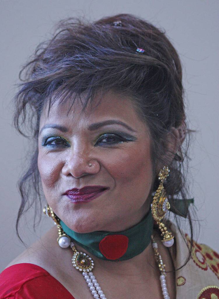 Nina Khan, of Nina&rsquo;s Fashionista Jewelry and Boutiques, smiles as she sells her sparkling selections. MARK KLAAS, Kent Reporter