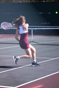 Amy Bender from Kentlake volleys during her win over Kentwood&rsquo;s Brianna Stroud. Bender won the match 6-2, 6-0.