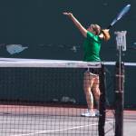 Sam Tate from Kentwood serves the ball during her match Wednesday with doubles partner Danielle Mendoza against Hallie Fredericks and Amber Smith.