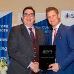 Chad Gleason, left, receives the 2017 Team Player of the Year award at the SVN National Conference. COURTESY PHOTO