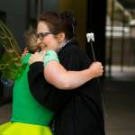 Smile Maker Joan Johnson hugs the Delta Dental of Washington Tooth Fairy to show her appreciation. COURTESY, VanHouten Photography