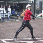 Kentlake sophomore Naomi King watches her foul ball leave the field.