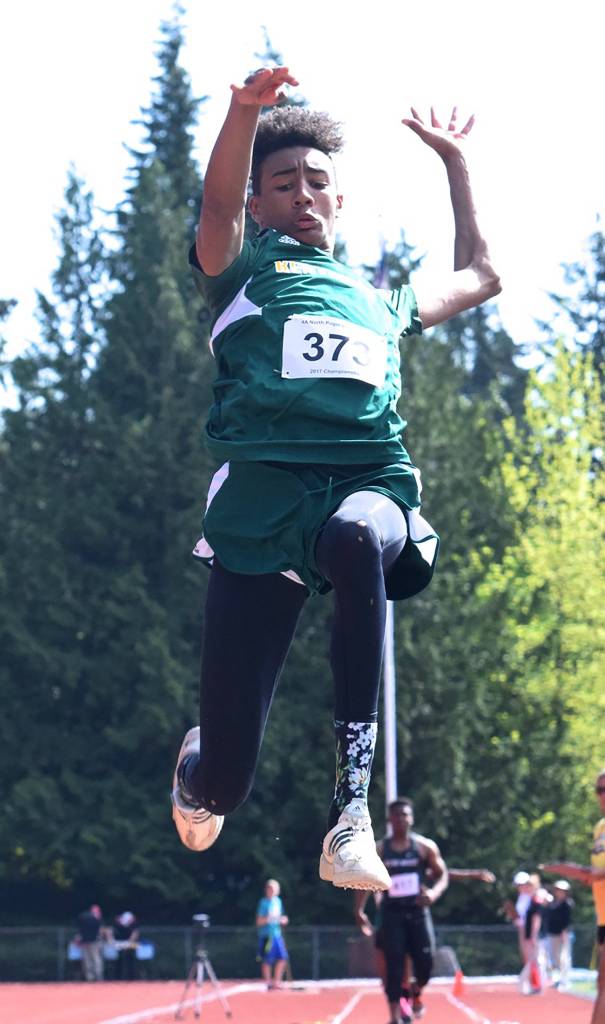 Kentridge&rsquo;s Tyler Cronk soars on the runway, taking third in the long jump at 21 feet, 4.75 inches. RACHEL CIAMPI, Kent Reporter